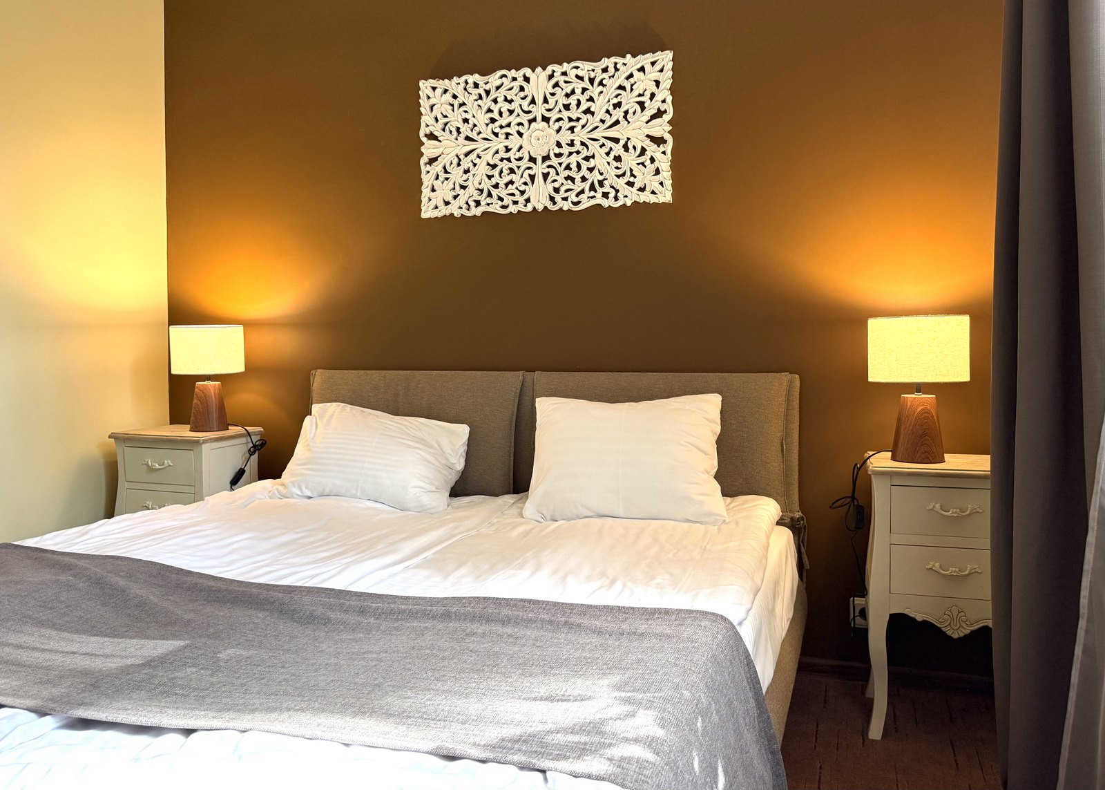 Junior Suite bedroom at Lucky Fish Jūrmala with a warm double bed and calm seating area